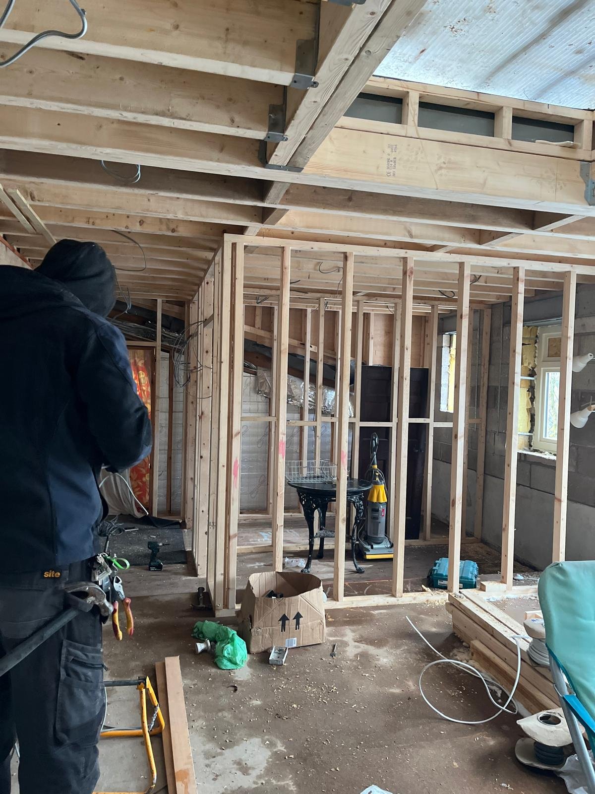Electrical first fix installation inside timber frame structure with exposed wiring and studs by U & O Electrical Manchester